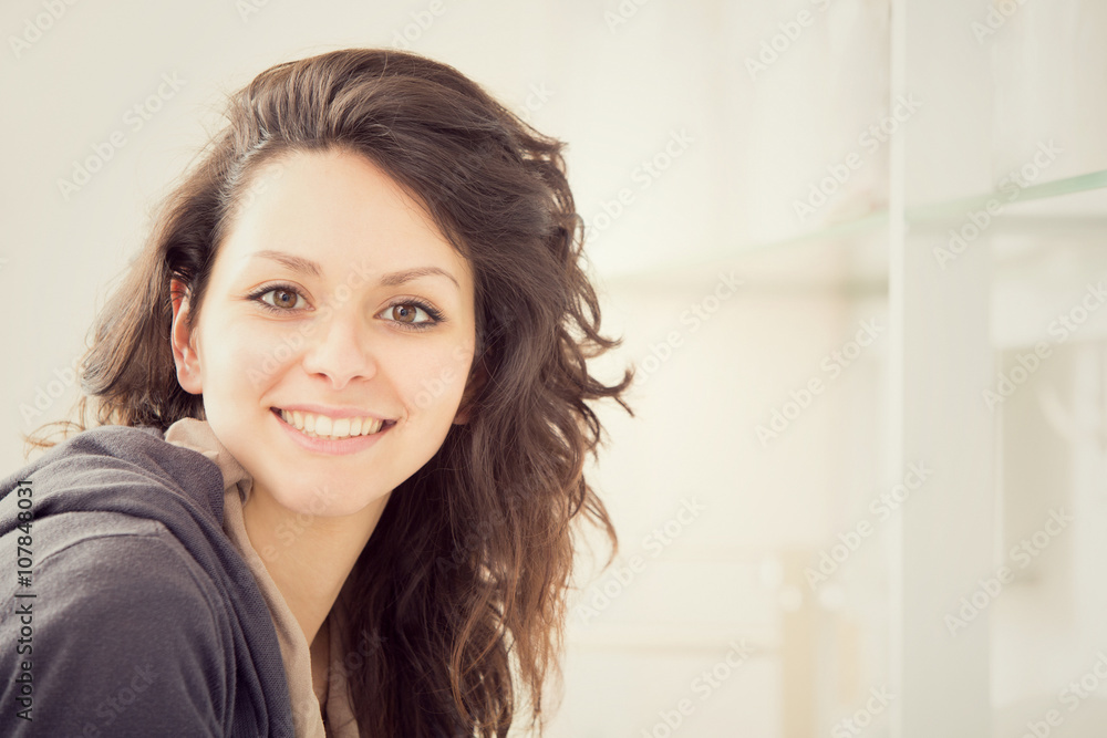young smiling brunette woman in the kitchen young smiling brunette woman in the kitchen