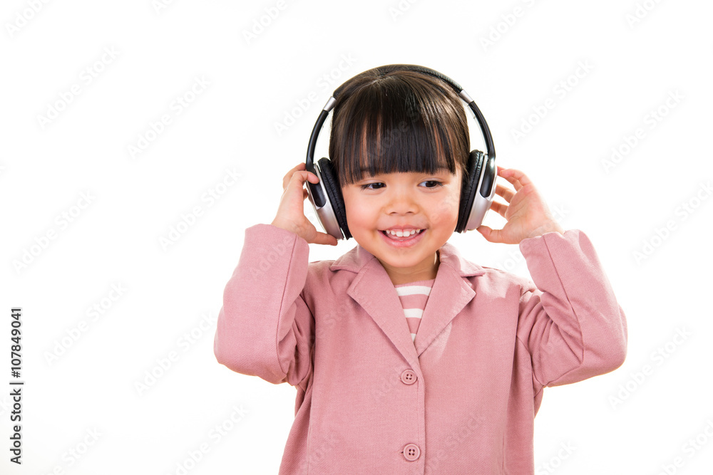 Asian smiling little girl portrait with headphones isolated on white Asian smiling little girl portrait with headphones isolated on white