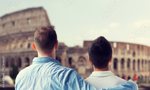 Photography close up of male gay couple over coliseum in rome