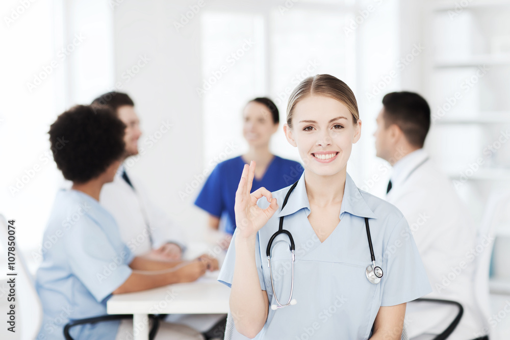 happy doctor over group of medics at hospital happy doctor over group of medics at hospital