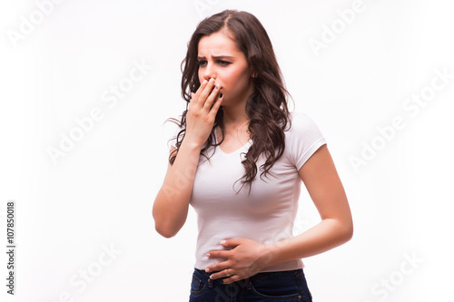 Closeup portrait of young unhappy, annoyed, sick woman about to chuck, throw up, retch barf, hurl isolated on white background.