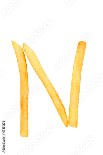N alphabet letter from French fries on the white