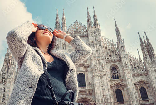Woman in sun eye glasses stay near Doumo di Milano photo