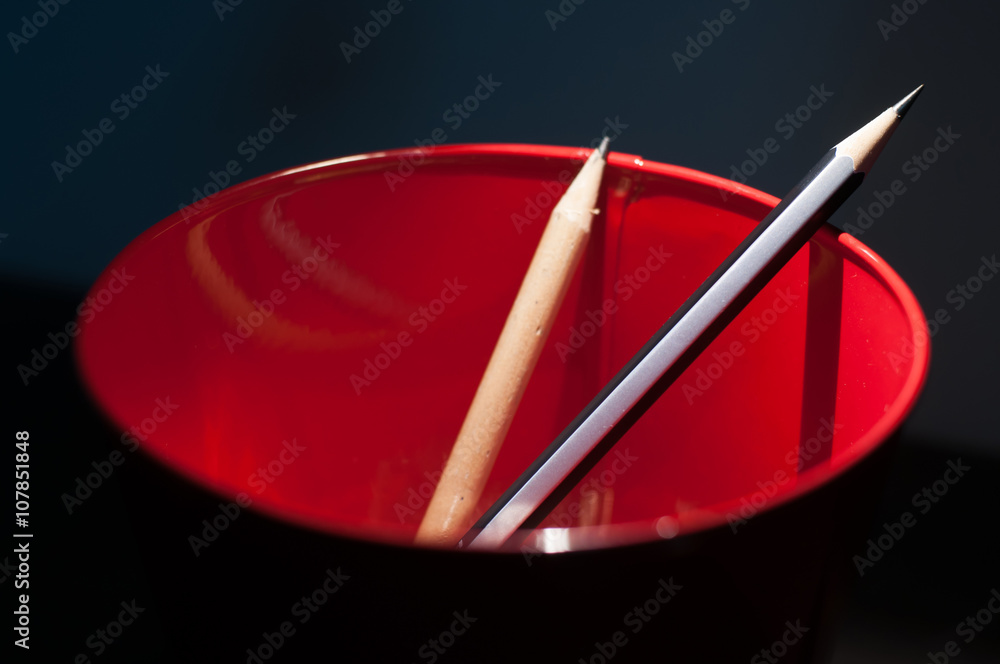 Pencils in a red bucket