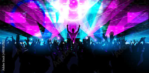 Electronic dance music festival with dancing people.