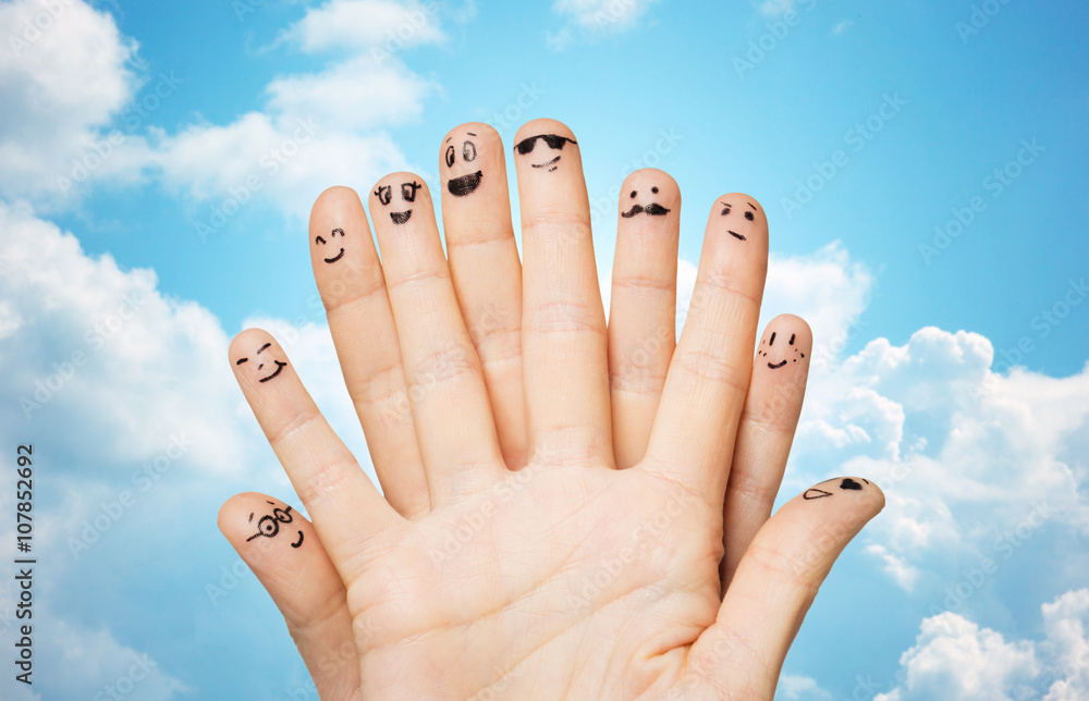 close up of hands and fingers with smiley faces close up of hands and fingers with smiley faces
