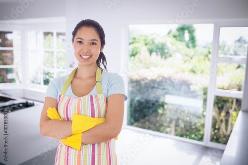 Free Download Composite image of smiling woman wearing rubber gloves and apron - GFXLoad