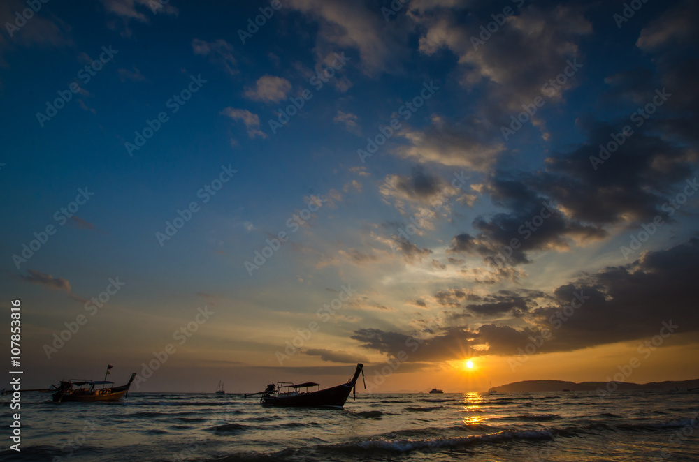 Traditional boats in Thailand at sunset