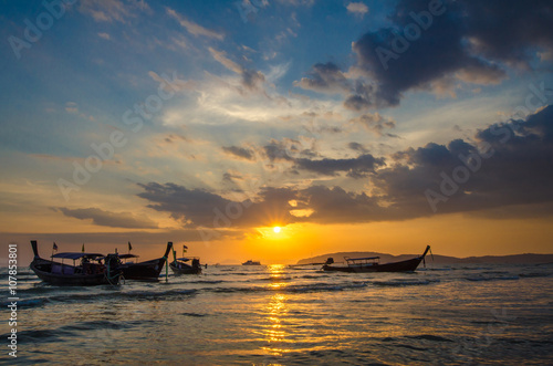 Traditional boats in Thailand at sunset