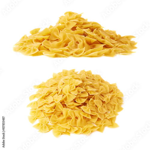 Pile of dry farfalle pasta over isolated white background
