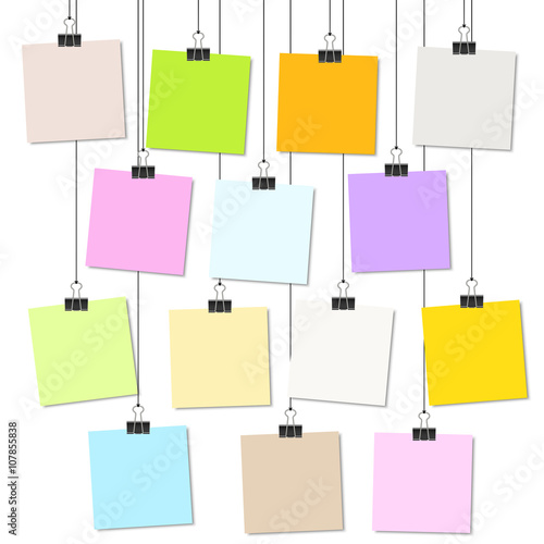 colored papers with binder clips