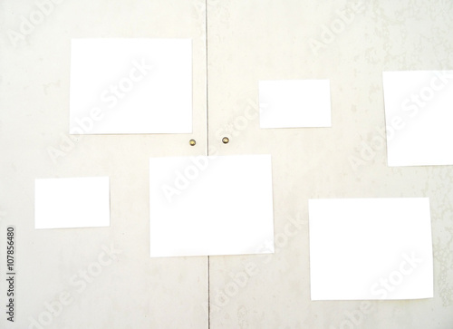 Papers on cream color wall