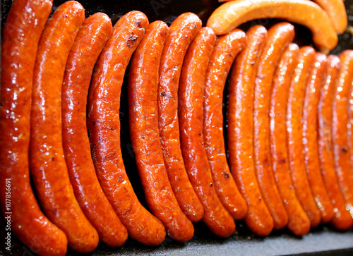 Sausages baked on iron plate in row party time