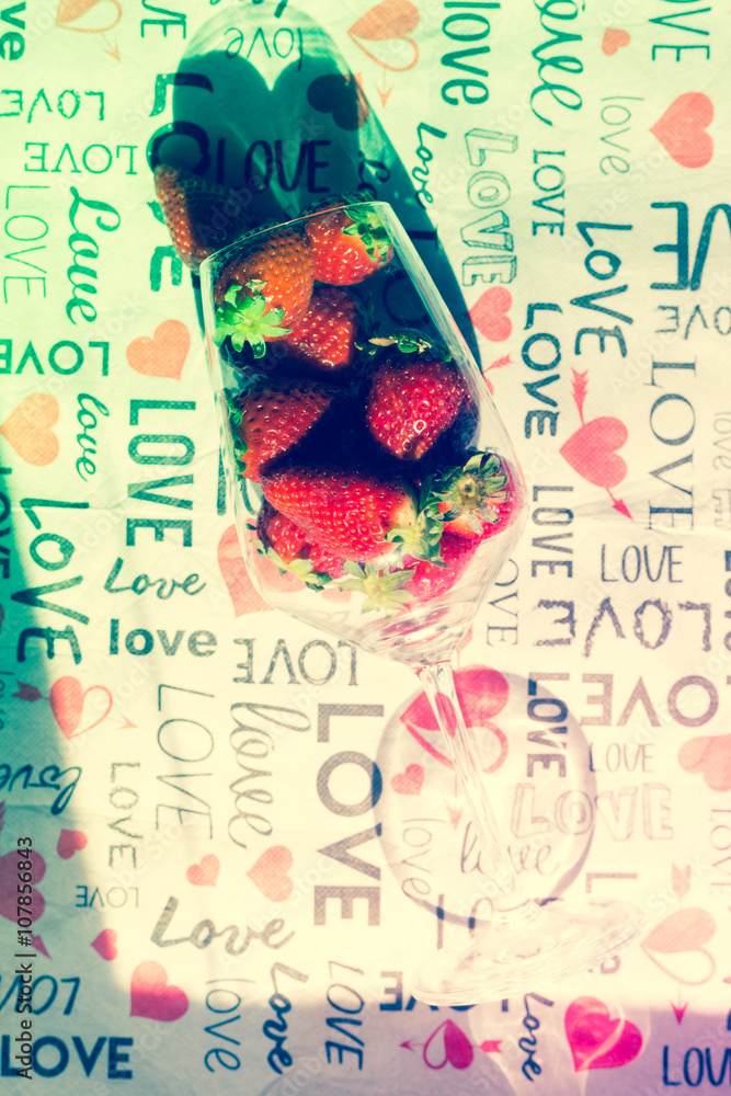 Obraz premium group of strawberries inside a glass, love style