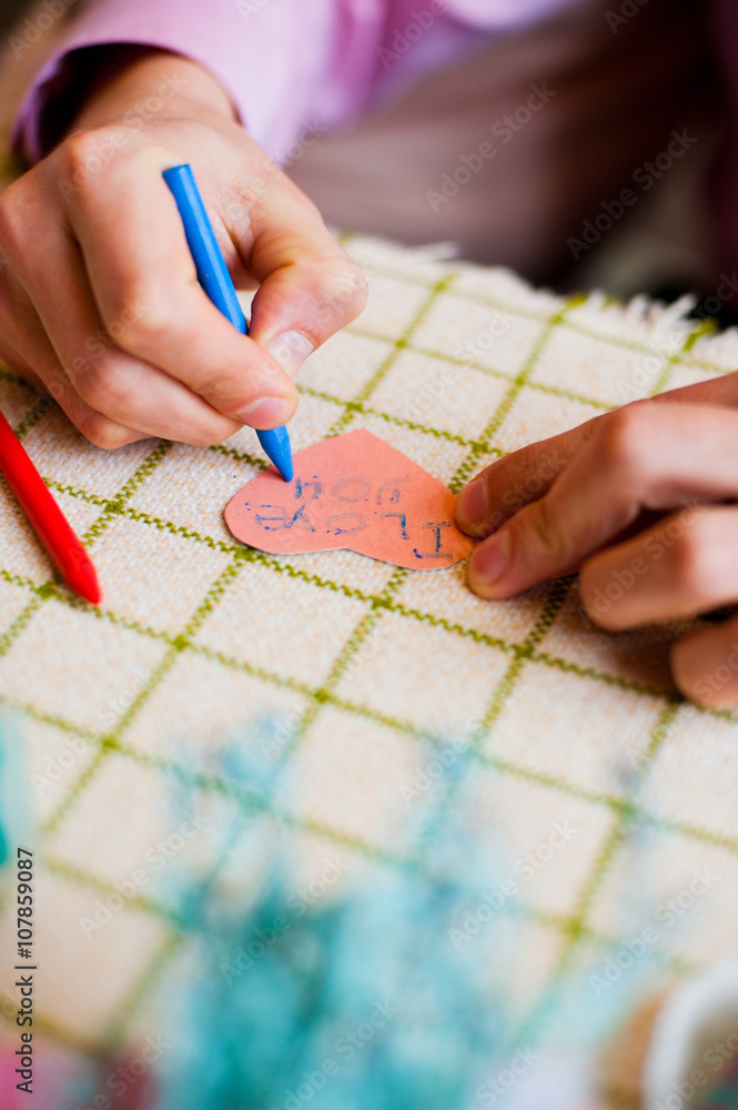 Close up of male hands writing words I love you Close up of male hands writing words I love you