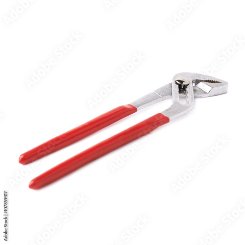 Metal plumber wrench over white isolated background