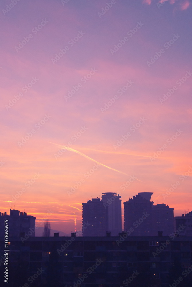 Beautiful blue and orange sky colors at sunshine over city landscape aerial view