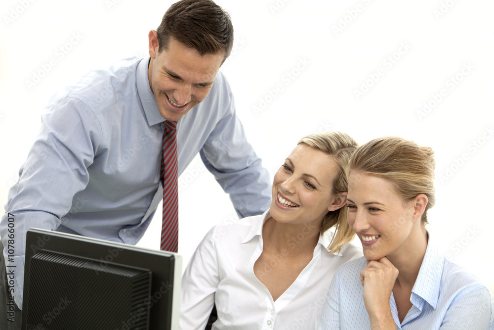 Businessman Computer training a couple of female office workers Businessman Computer training a couple of female office workers