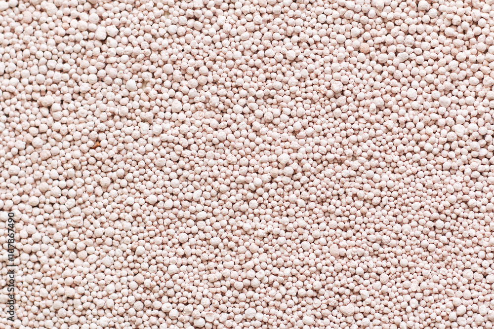 Pink background with mineral fertilizers balls. Pink background with mineral fertilizers balls.