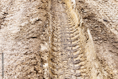 deep ruts in loamy soil of country road © vvoe