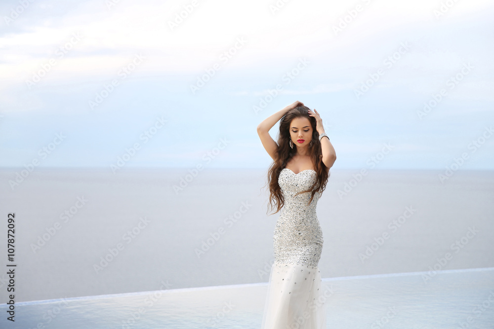 Beautiful Bride in wedding dress, outdoor portrait. Brunette ele Beautiful Bride in wedding dress, outdoor portrait. Brunette ele