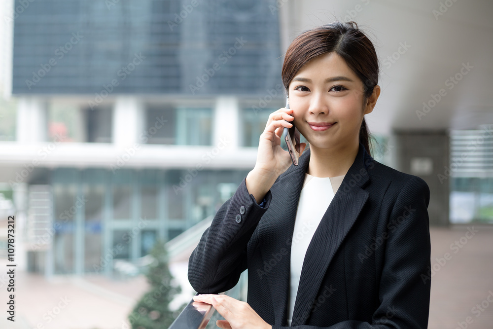 Businesswoman talk to mobile phone at outdoor