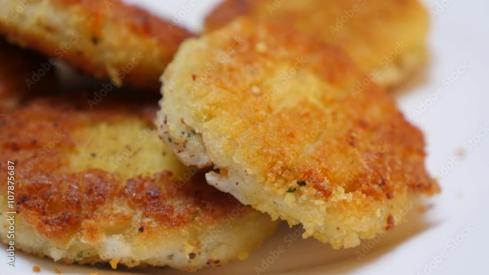 In vegetable oil deep fried fish burger pieces close-up 4K 2160p 30fps UltraHD tilting video - Fried on oil fish bars slow tilt 4K 3840X2160 UHD footage In vegetable oil deep fried fish burger pieces close-up 4K 2160p 30fps UltraHD tilting video - Fried on oil fish bars slow tilt 4K 3840X2160 UHD footage