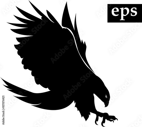 black silhouette of flying eagle with spread wings