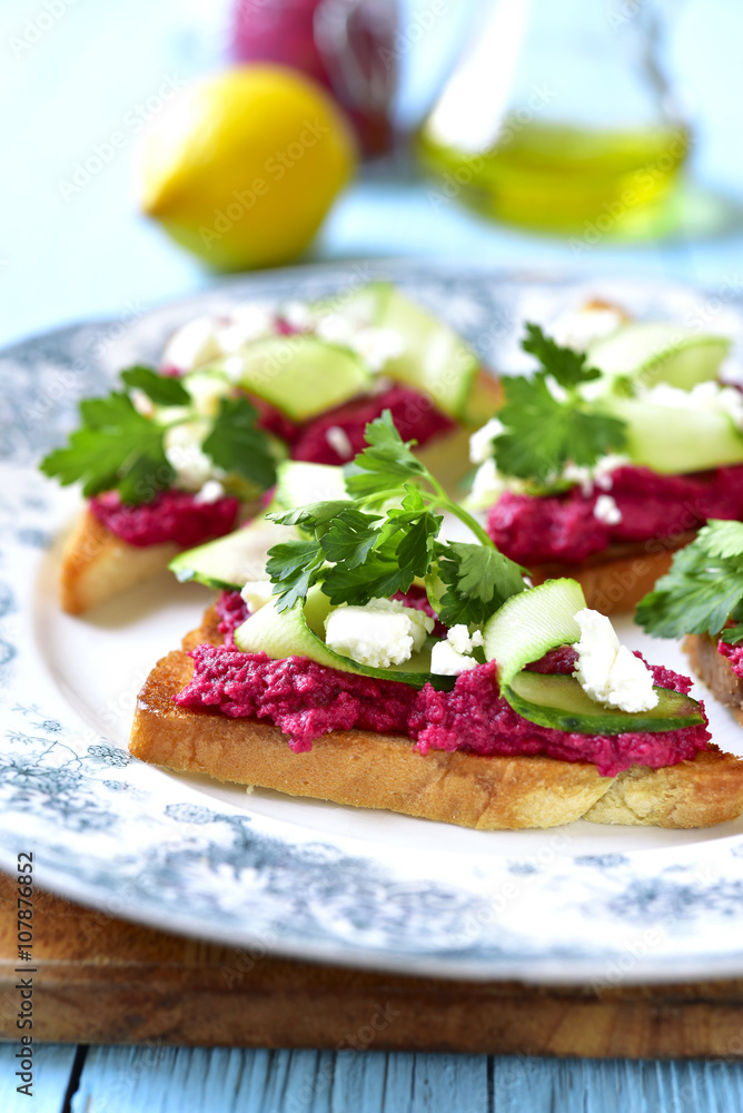 Sandwich with beetroot hummus,cucumber and feta.