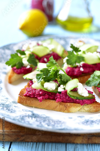 Sandwich with beetroot hummus,cucumber and feta.
