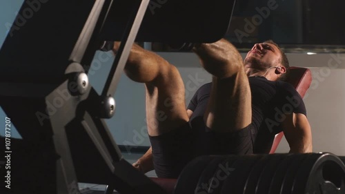 man doing leg press at the gym