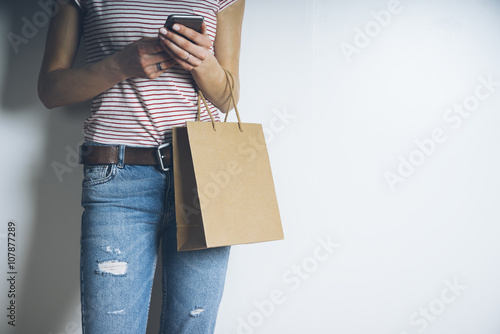 Young woman with craft paper package, mock up