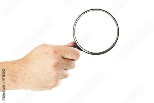 Male hand holding magnifying glass on a white background