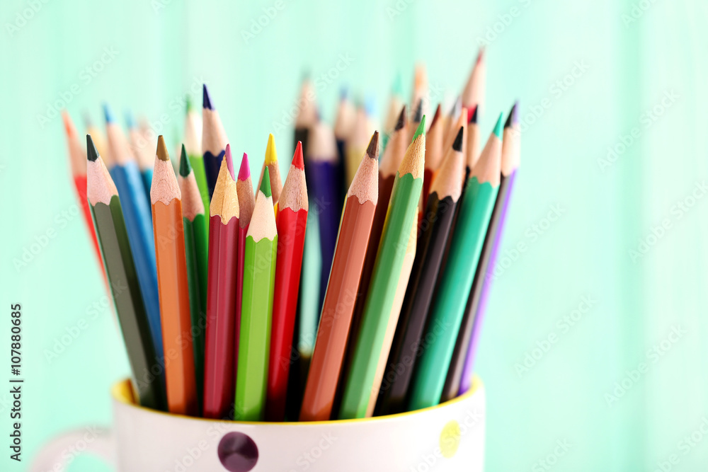 Fototapeta premium Drawing colourful pencils on a wooden background
