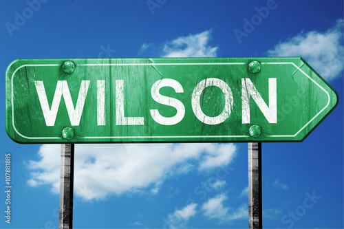 wilson road sign , worn and damaged look