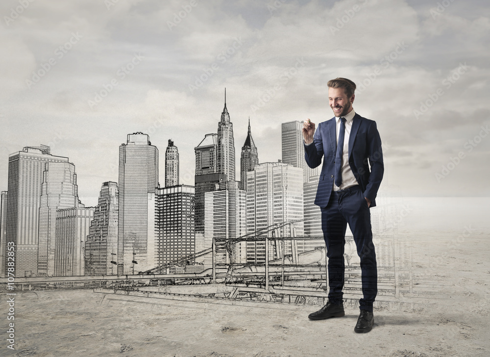 Smiling businessman projecting the skyline Smiling businessman projecting the skyline