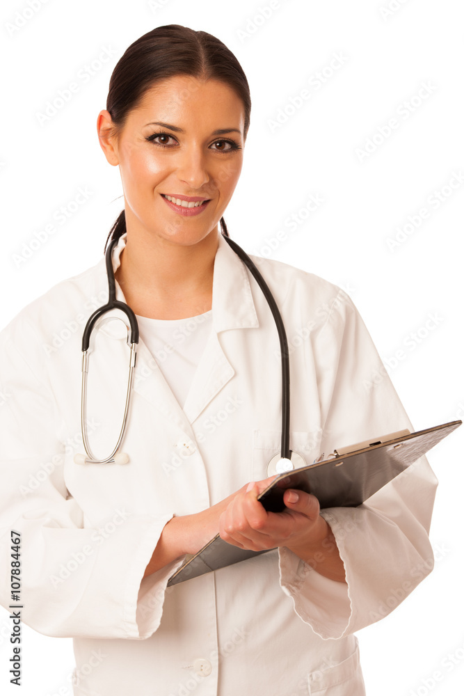 Woman doctor with stethoscope around neck writing diagnose on cl Woman doctor with stethoscope around neck writing diagnose on cl