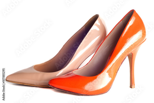 ? bright, multicolored female shoes on high heels isolated on white background