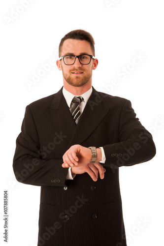 Successful businessman in formal suit chacking time on wrist wat photo