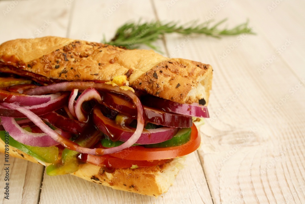 Obraz premium sandwiches with salad, onion, salami, pepperoni, ham, cheese and