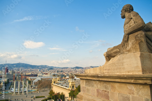 male statue overlooking city square © aygulchik99