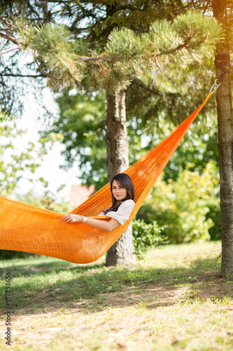 Nice girl resting in hammock