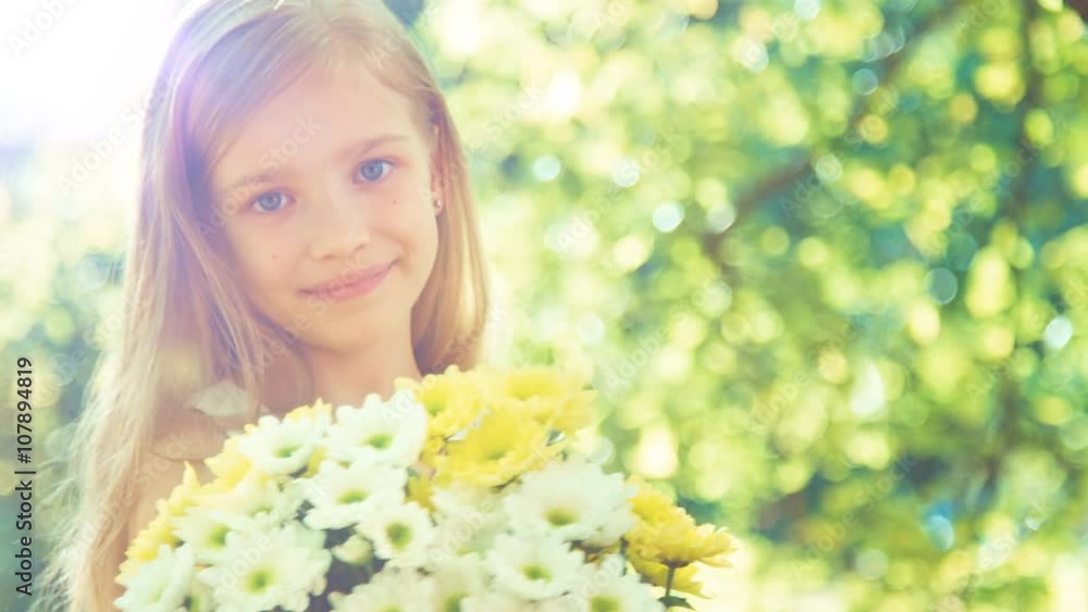 Closeup portrait girl holding bouquet of flowers and showing flowers at camera. Sunlight and Lens flare Closeup portrait girl holding bouquet of flowers and showing flowers at camera. Sunlight and Lens flare