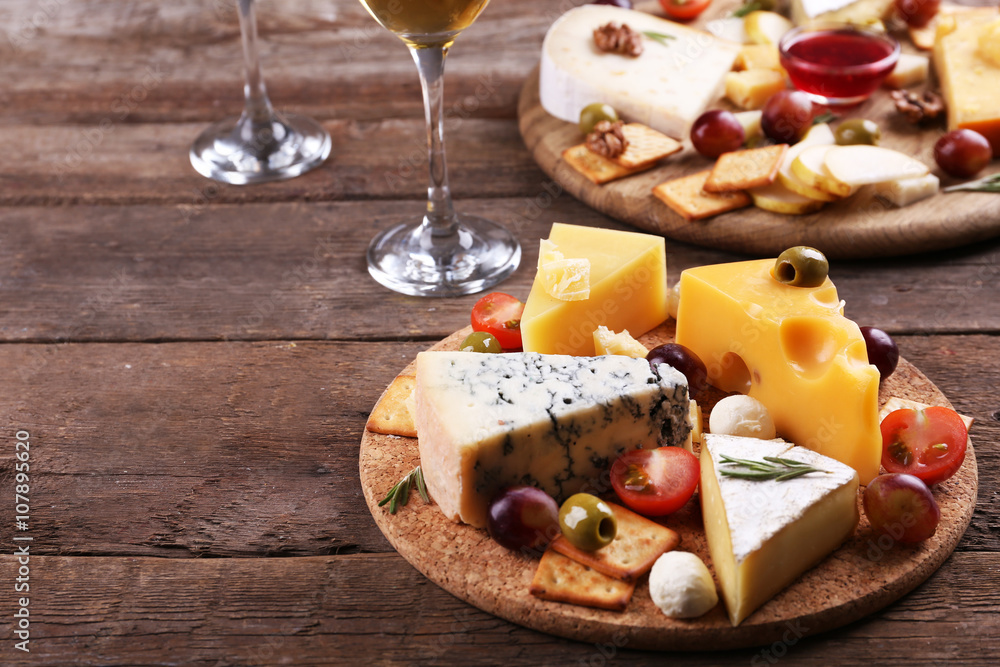 Different kinds of cheese on wooden background Different kinds of cheese on wooden background