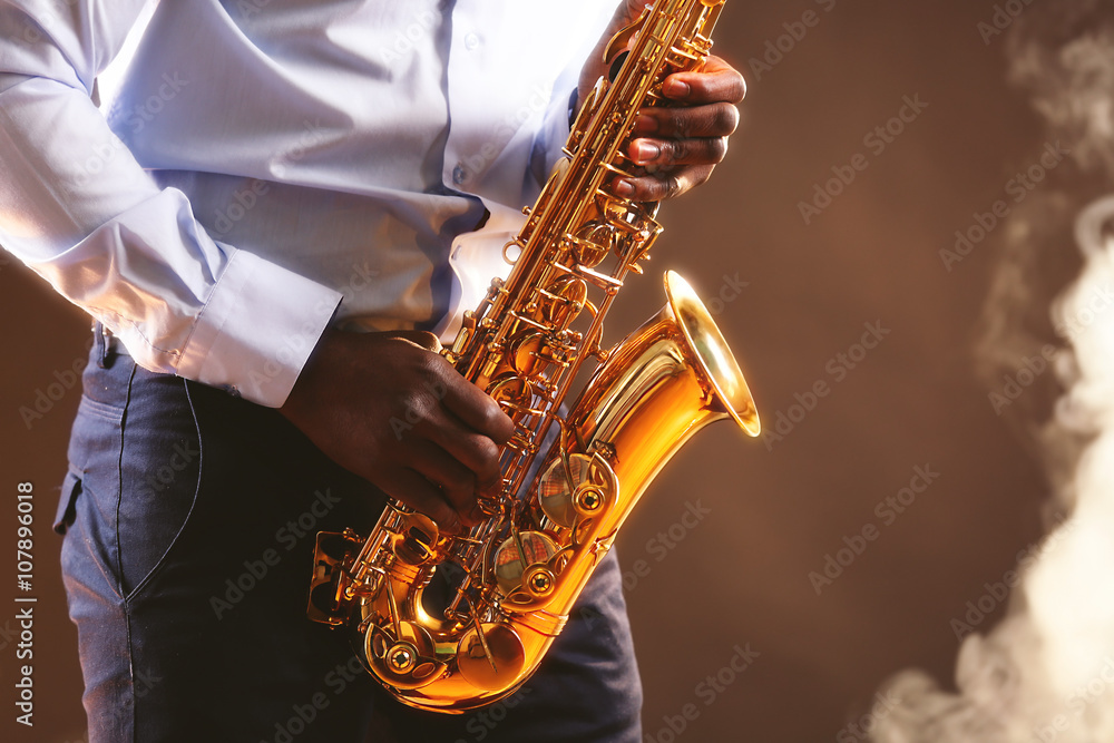 Fototapeta premium African American jazz musician playing the saxophone, closeup