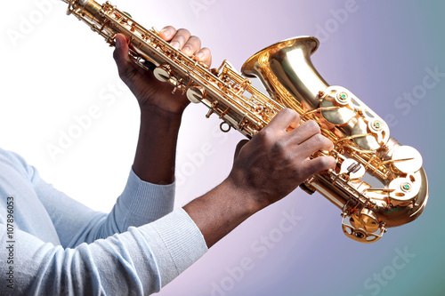 Canvas Print African American jazz musician playing the saxophone, closeup