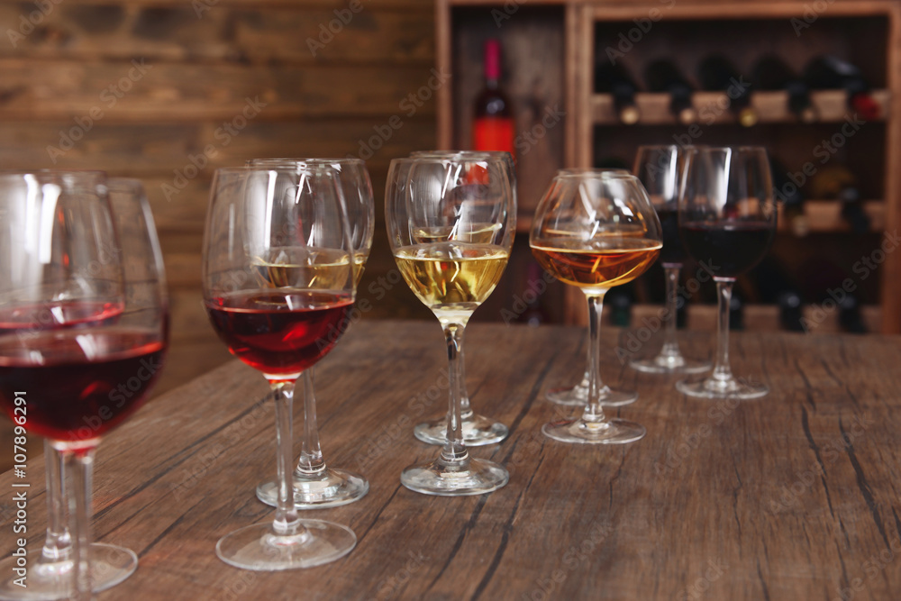 Many glasses of different wine in a row on bar counter Many glasses of different wine in a row on bar counter
