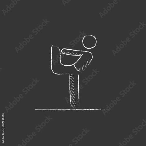 Man practicing yoga. Drawn in chalk icon.
