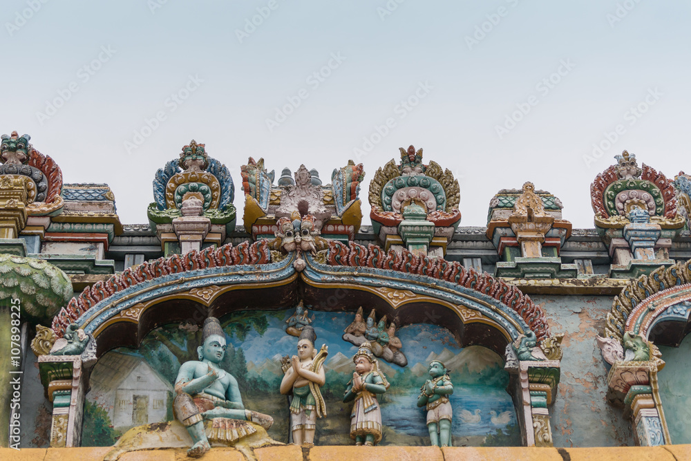 Trichy, India - October 15, 2013: Closeup of a statue scenery at Ranganathar Temple showing Lord Rama mapping the attack on Lanka to liberate his wife Sita, in front of his brother Lakshman, Hanuman.