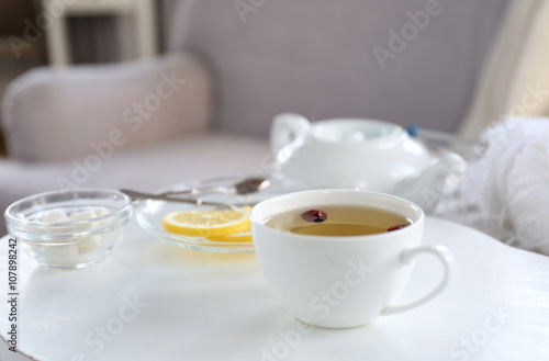 Tea set on a white wooden tray